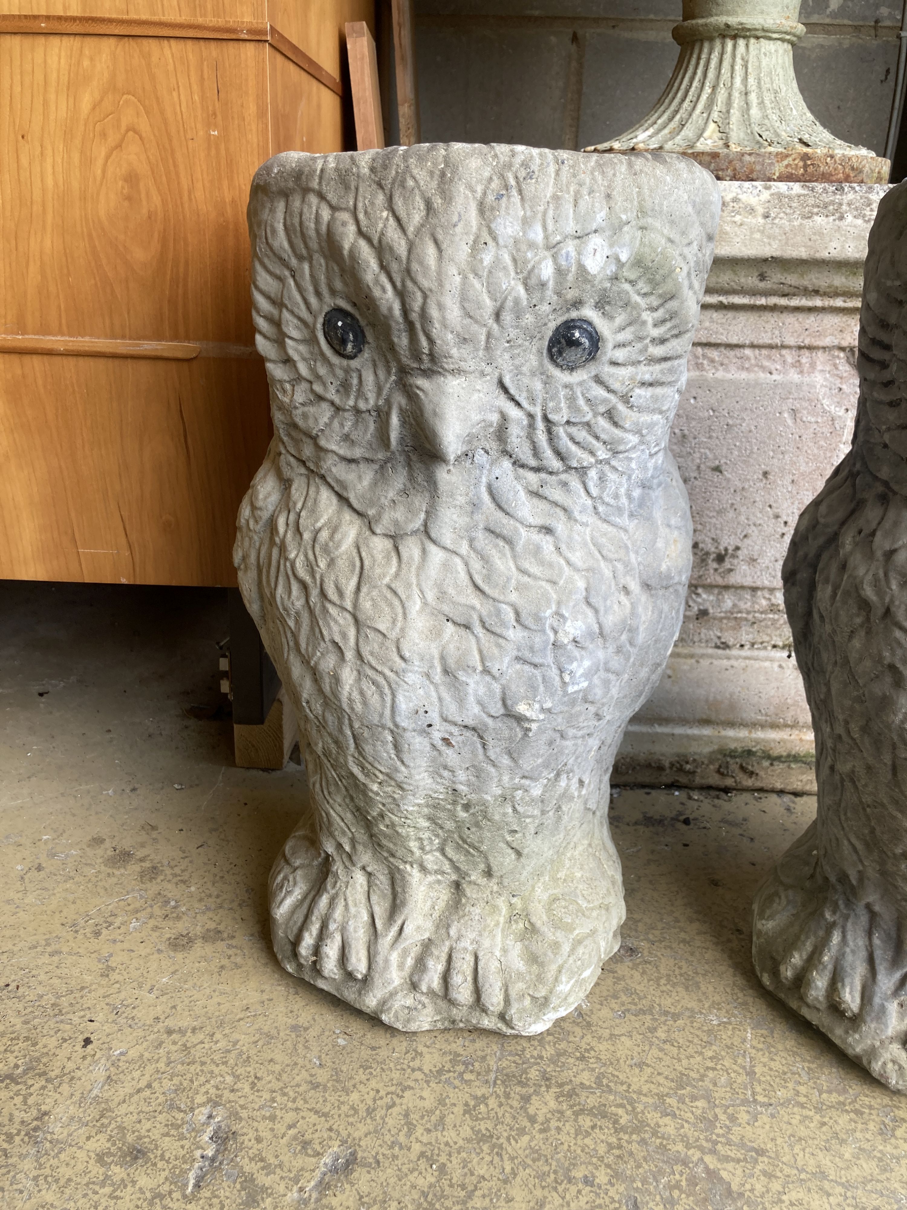 A pair of reconstituted stone owl garden planters, height 50cm